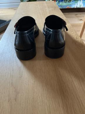 Prada Black Leather Circular Buckle Loafers 4