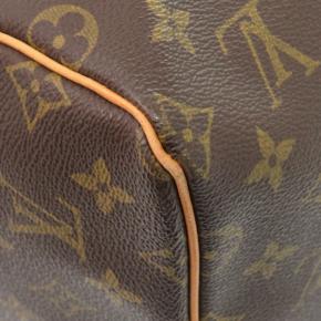 Louis Vuitton Coated Canvas Monogram Keepall 55 7