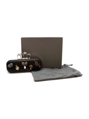 Alexander McQueen embellished black leather four-ring clutch bag